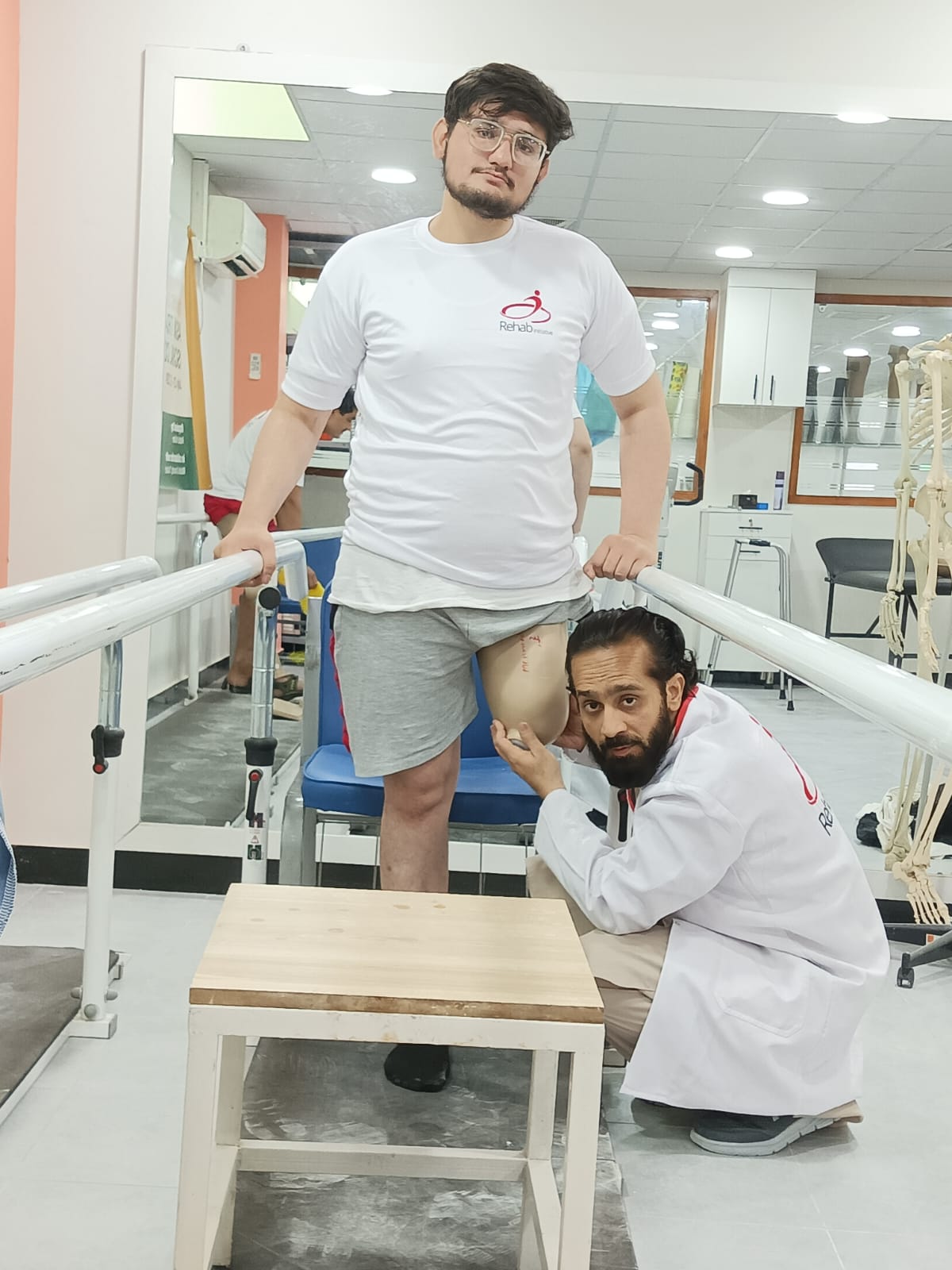 Patient practising walking with clinical support at Ortho Care Home