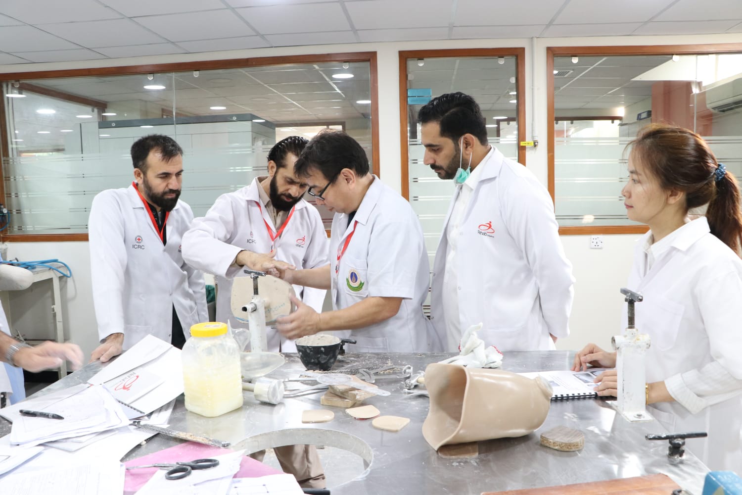 Ortho Care Home specialists working on patient-specific devices
